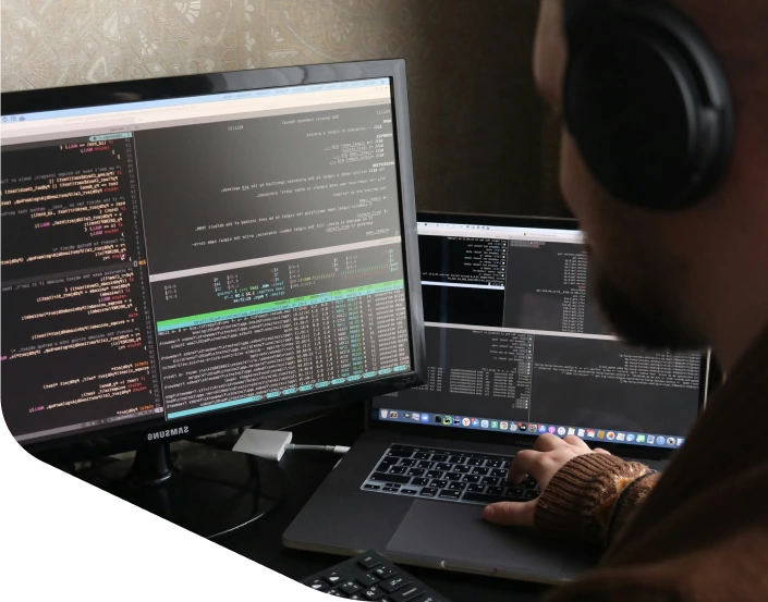 SaaS developer working with headphones on — Snowball Creations clients