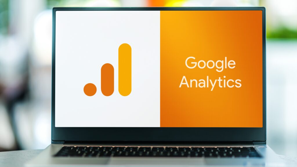 A laptop screen with the Google Analytics logo.